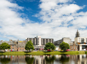 Front exterior of Mercure Inverness Hotel as seen across the River Ness