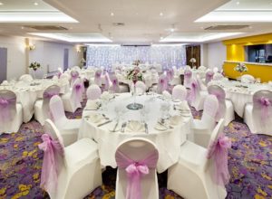 Wide angle shot of the Halliwell Suite set for a wedding at Mercure London Watford Hotel