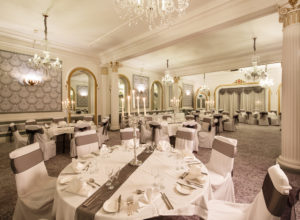 Tables anc chairs set for a wedding in the Ballroom at Mercure Brighton Seafront Hotel